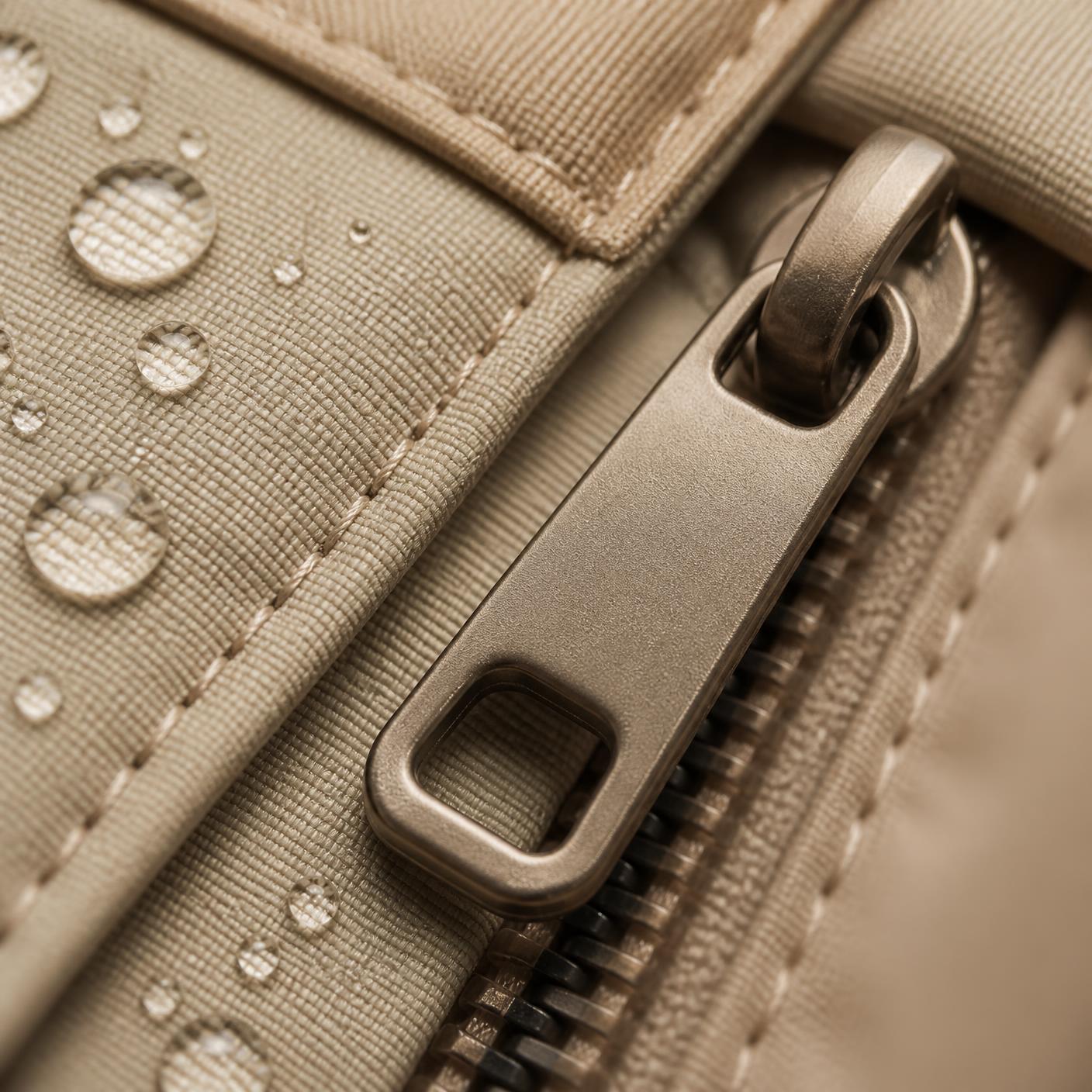 Coated shell fabric and reverse-coil zippers
